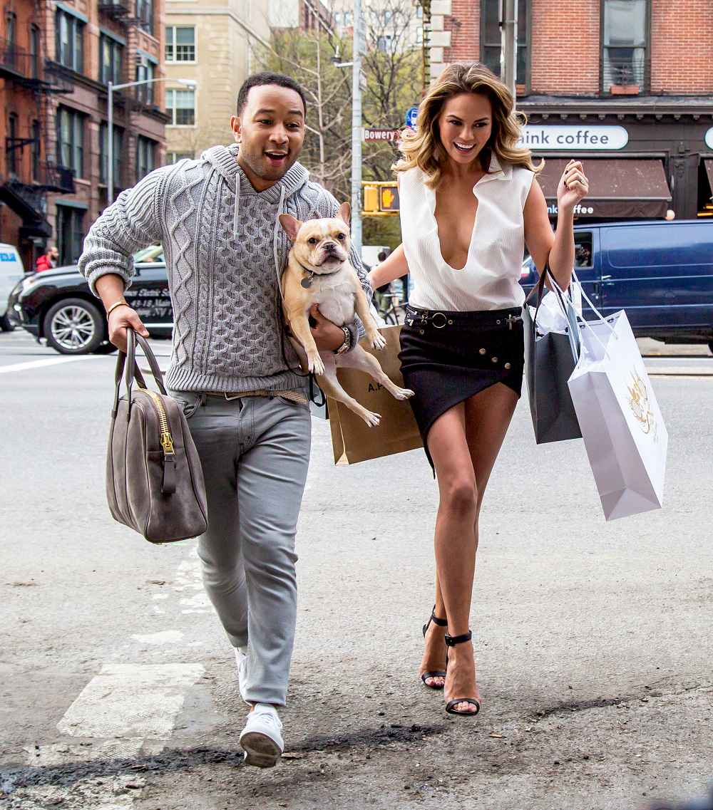 John Legend and Chrissy Teigen with their dog during a photo shoot in New York City.