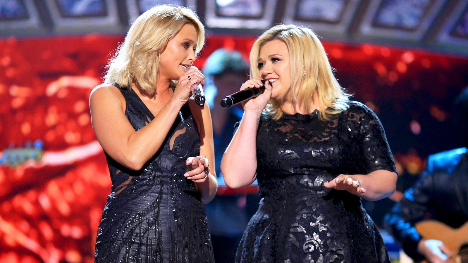Miranda Lambert and Kelly Clarkson perform onstage during the 2014 American Country Countdown Awards at Music City Center in Nashville, Tennessee.