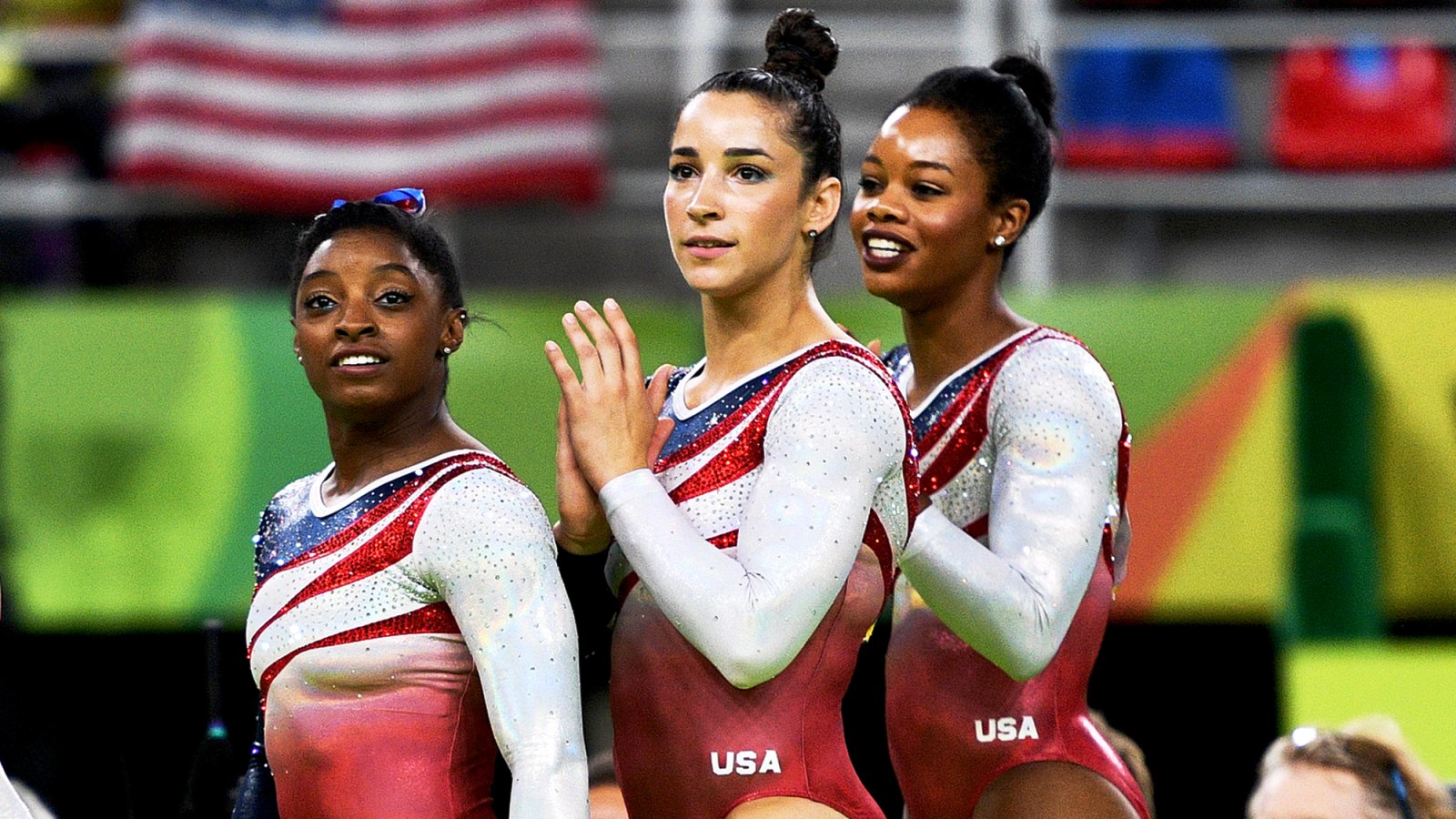 Simone Biles, Aly Raisman and Gabby Douglas of the United States celebrate winning the gold medal during the Artistic Gymnastics Women's Team Final on Day 4 of the Rio 2016 Olympic Games at the Rio Olympic Arena in Rio de Janeiro, Brazil.