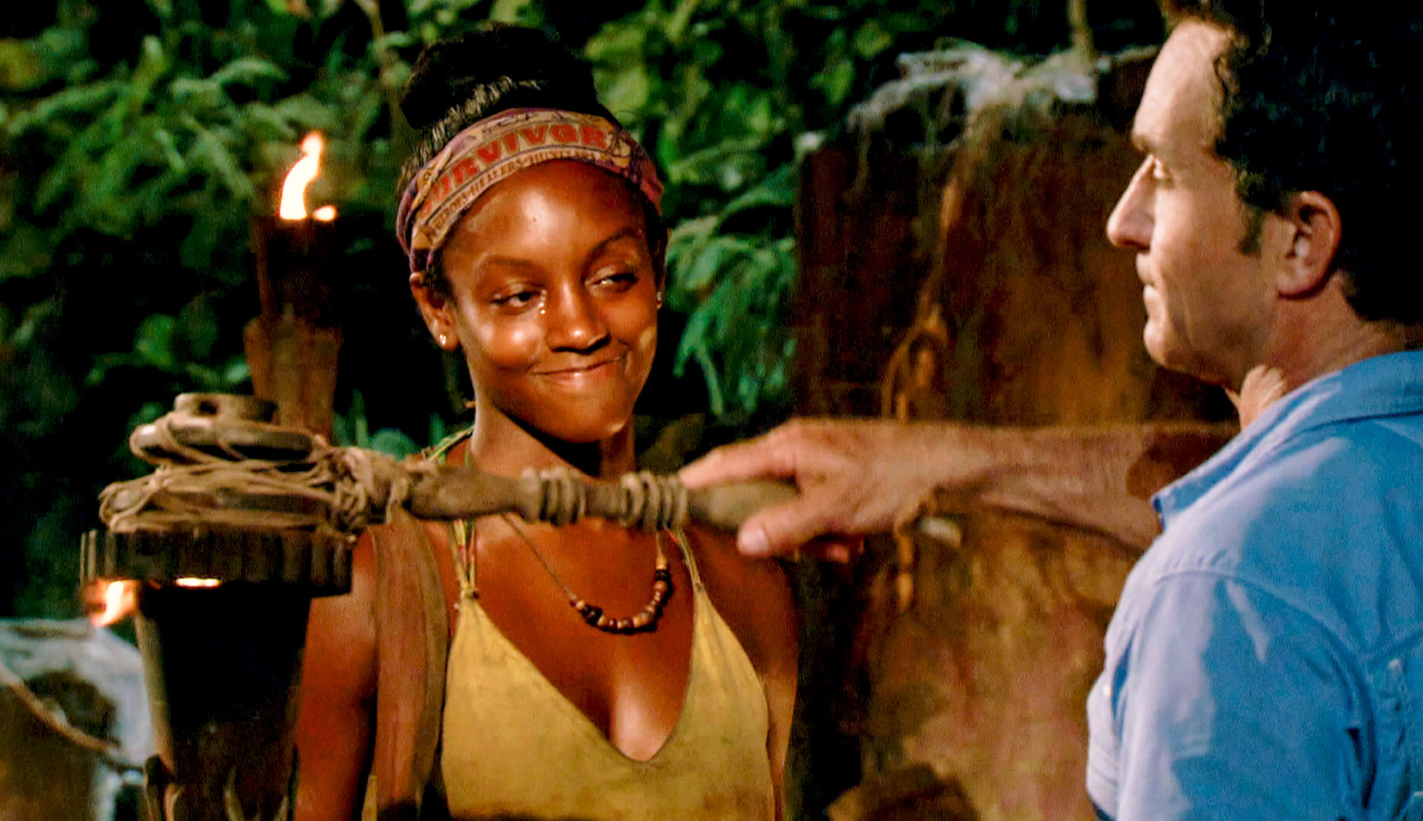 Jeff Probst extinguishes Desi Williams torch at Tribal Council on the eighth episode of Survivor themed Heroes vs. Healers vs. Hustlers