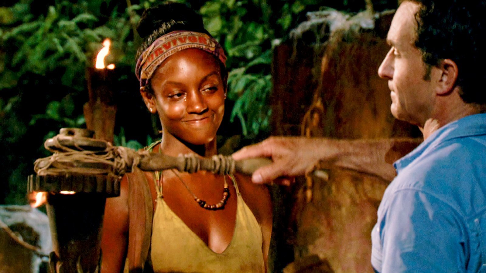 Jeff Probst extinguishes Desi Williams torch at Tribal Council on the eighth episode of Survivor themed Heroes vs. Healers vs. Hustlers