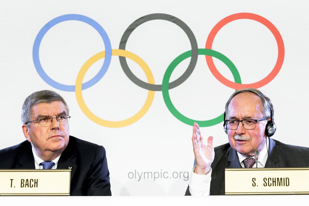 International Olympic Committee (IOC) President Thomas Bach and Chairman of IOC Inquiry Commission into alleged Russian doping at Sochi 2014 Swiss Samuel Schmid attends a press conference following an executive meeting on Russian doping, on December 5, 2017 in Lausanne.