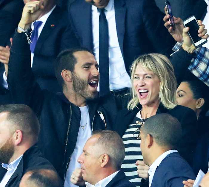 Clement Giraudet and Robin Wright attends the UEFA Champions League group B match at Parc des Princes on September 27, 2017 in Paris, France.