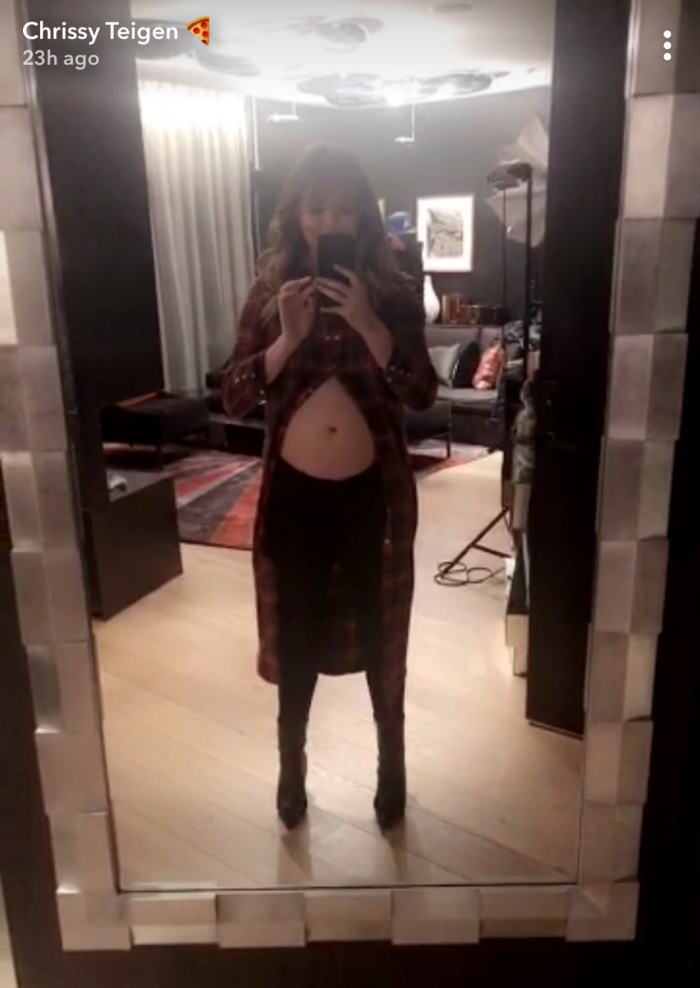 Chrissy Teigen displays her baby bump on Snapchat.