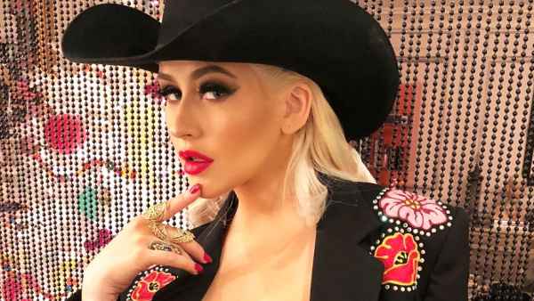 Christina Aguilera wears a cowgirl outfit to a holiday party