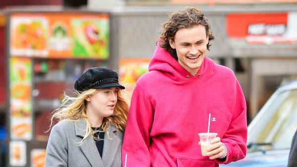 Dakota Fanning and Henry Frye holding hands