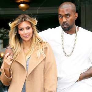 Kim Kardashian and Kanye West are seen on the 'Avenue Montaigne' on September 28, 2013 in Paris, France.