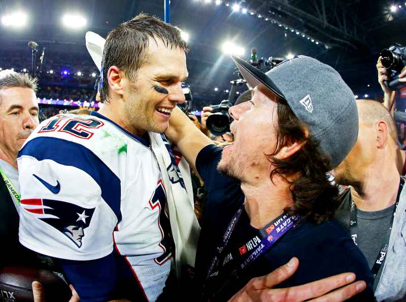 Tom Brady #12 of the New England Patriots celebrates with Mark Wahlberg after defeating the Seattle Seahawks 28-24 to win Super Bowl XLIX at University of Phoenix Stadium in Glendale, Arizona.