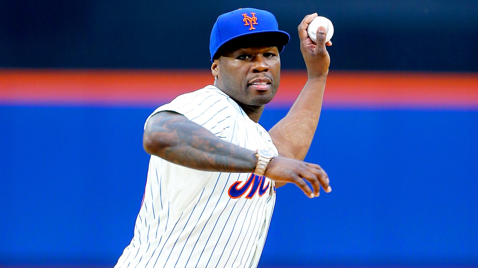 50 Cent throws the ceremonial first pitch of a game between the New York Mets and the Pittsburgh Pirates at Citi Field on May 27, 2014 in New York City.