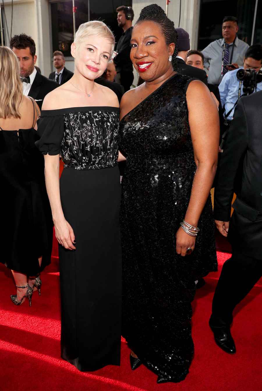 Michelle Williams and activist Tarana Burke arrive to the 75th Annual Golden Globe Awards held at the Beverly Hilton Hotel on January 7, 2018.
