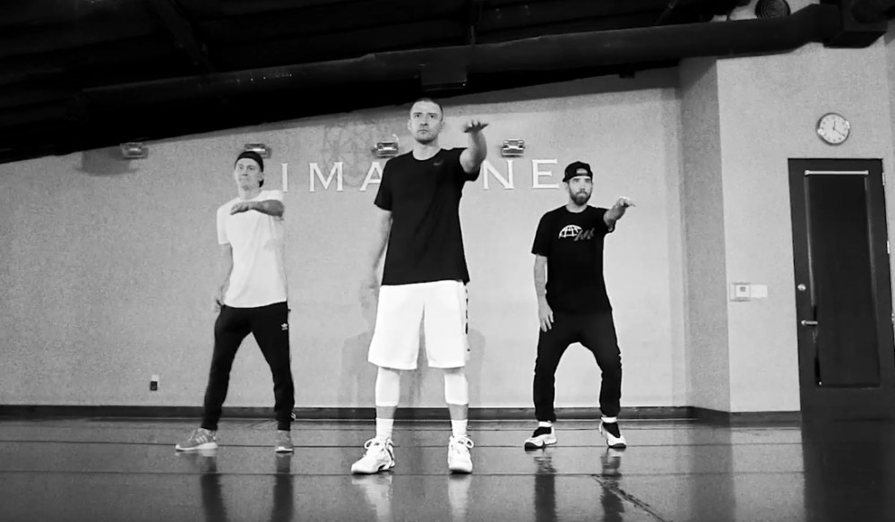 Justin Timberlake shows off his dance steps in monochrome outfit