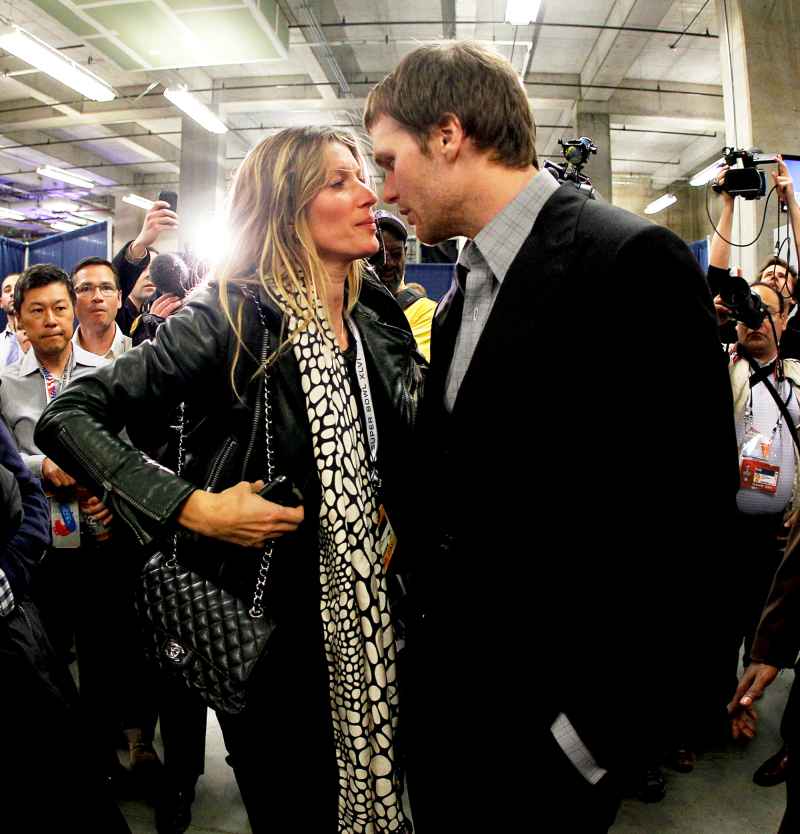 Tom Brady #12 of the New England Patriots chats with his wife Gisele Bundchen during the Super Bowl XLVI at Lucas Oil Stadium in Indianapolis, Indiana.