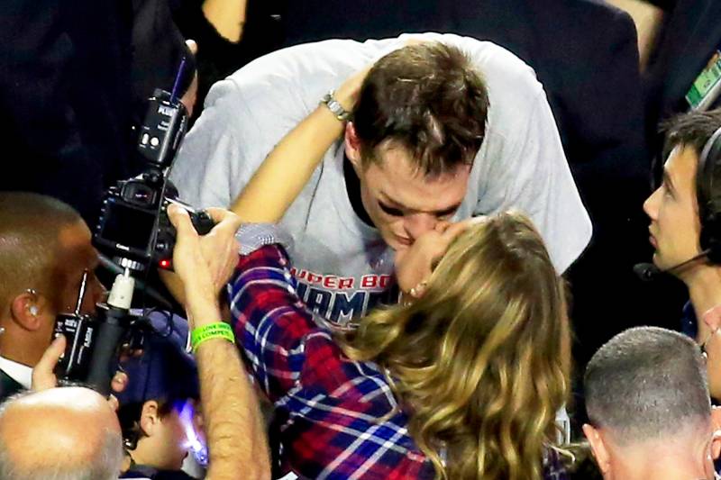 Tom Brady #12 of the New England Patriots kisses his wife Gisele Bundchen after defeating the Seattle Seahawks during Super Bowl XLIX at University of Phoenix Stadium on February 1, 2015 in Glendale, Arizona.