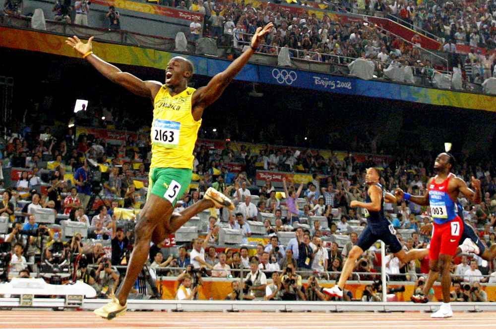 Jamaica's Usain Bolt celebrates winning the men's 200m final at the National stadium as part of the 2008 Beijing Olympic Games on August 20, 2008.