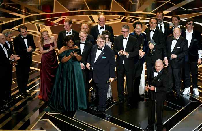 Mexican director Guillermo del Toro stands on stage with his cast and crew after he won the Oscar for Best Film for "The Shape of Water" during the 90th Annual Academy Awards show on March 4, 2018 in Hollywood, California.