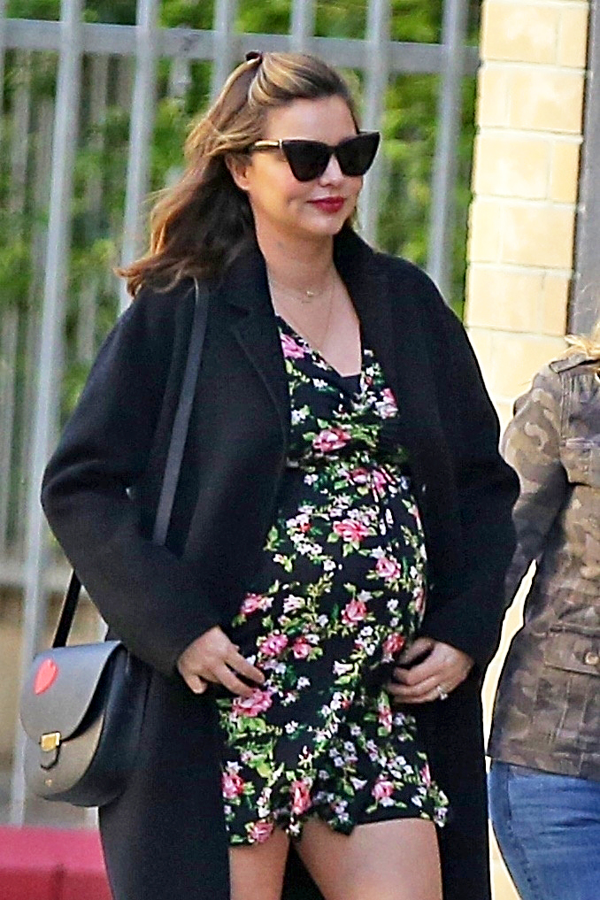 Pregnant Miranda Kerr Shows Off Baby Bump in Floral Dress on March 25, 2018.
