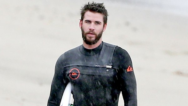 Liam Hemsworth surfing