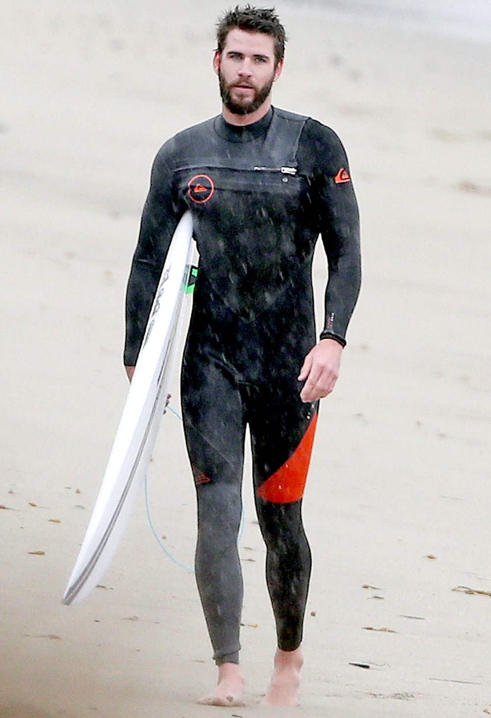 Liam Hemsworth surfing