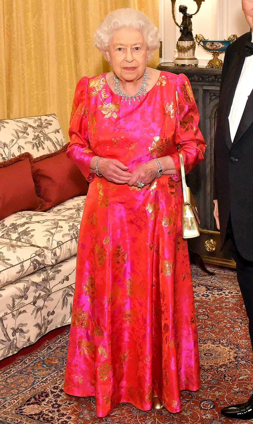 Queen Elizabeth II Wears Pink Gown, Gold Handbag: Pics | Us Weekly Queen Elizabeth II Wears Pink Gown, Gold Handbag: Pics | Us Weekly