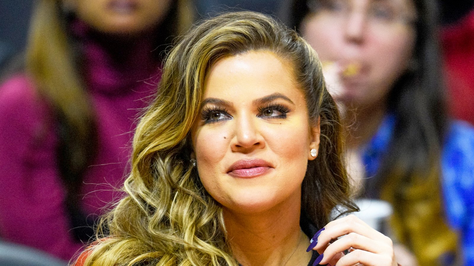 Khloe Kardashian attends a 2014 basketball game between the Detroit Pistons and the Los Angeles Clippers at Staples Center in Los Angeles, California.