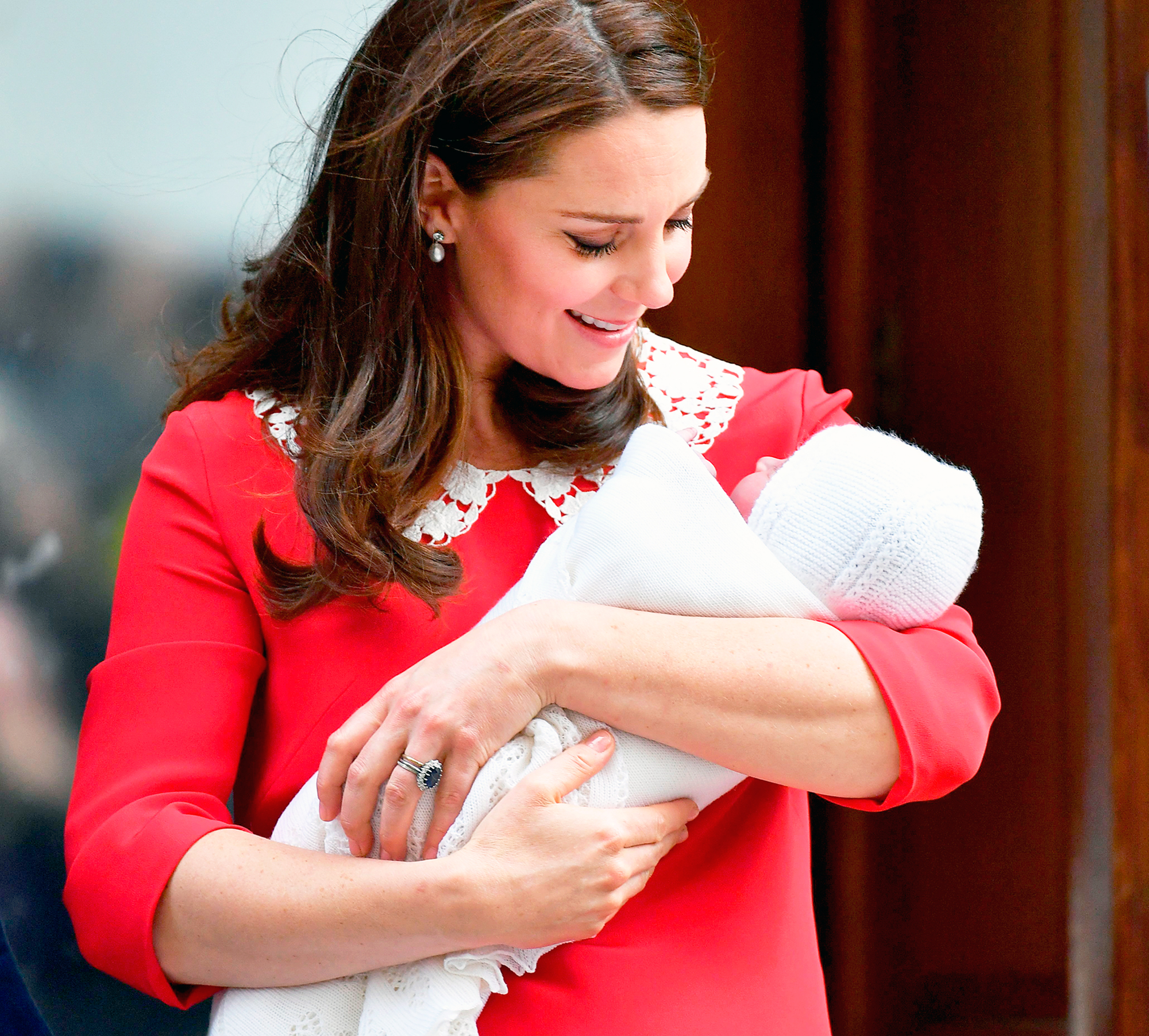 Kate Middleton looks at Prince Louis of Cambridge on the steps of the Lindo Wing at St Mary's Hospital in London, England on April 23, 2018.