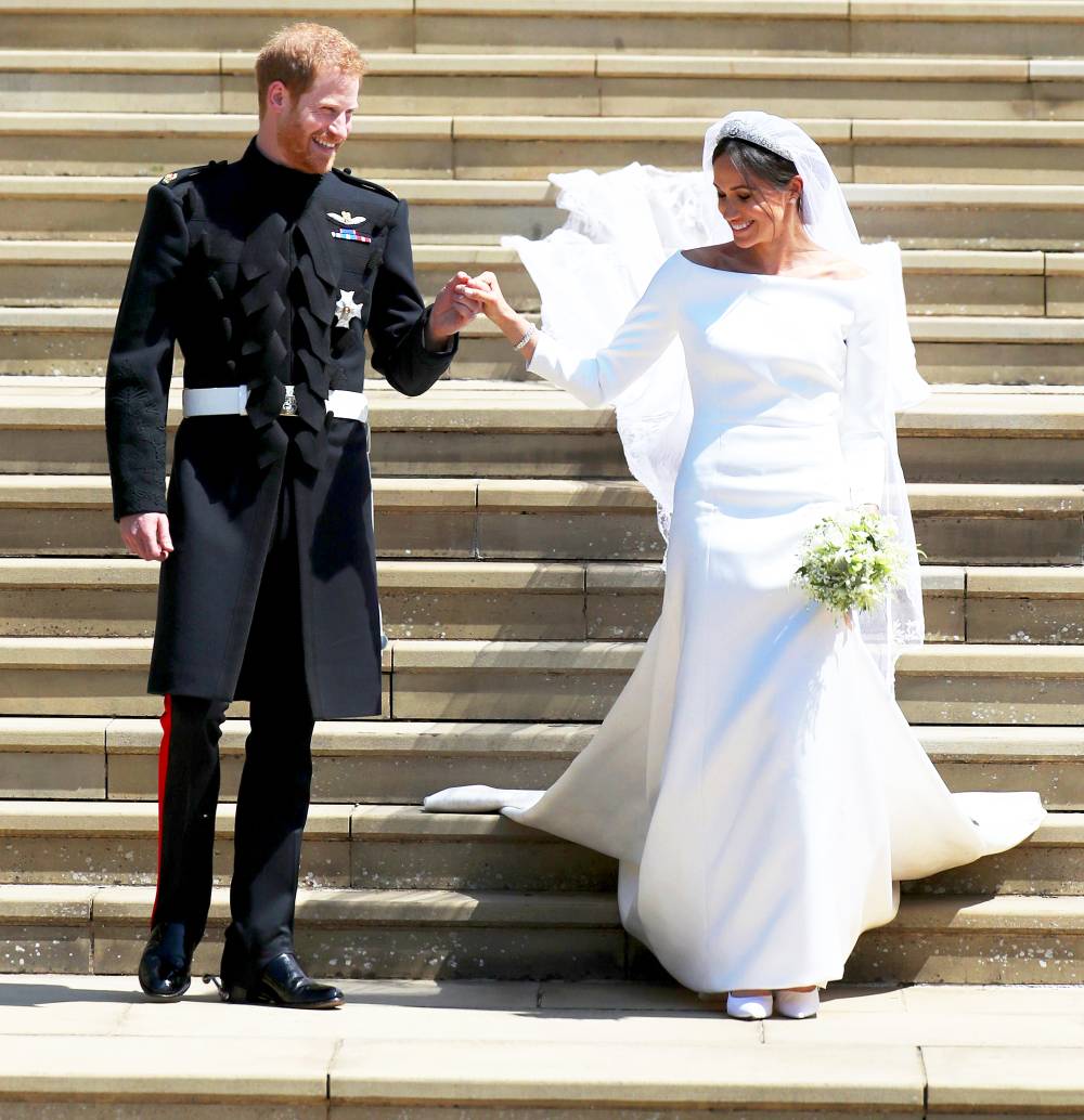 Prince Harry and Meghan Markle emerge from the West Door of St George's Chapel, Windsor Castle, in Windsor, on May 19, 2018 after their wedding ceremony.