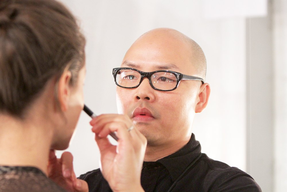 Daniel Martin lead makeup artist backstage at NYX Cosmetics Official Makeup Sponsor of Nicholas K Spring/Summer 2014 at Lincoln Center in New York City.