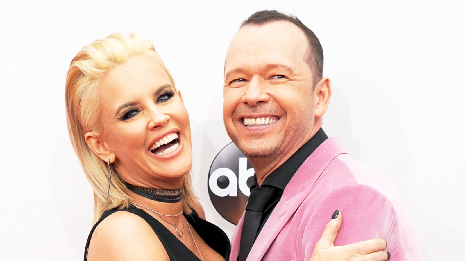 Jenny McCarthy and Donnie Wahlberg arrive at the 2016 American Music Awards at Microsoft Theater in Los Angeles, California.