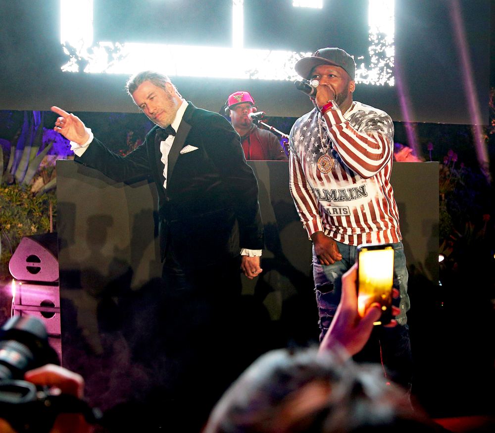 John Travolta and 50 Cent on stage during the party in Honour of John Travolta's receipt of the Inaugural Variety Cinema Icon Award during the 71st annual Cannes Film Festival on May 15, 2018 in Cap d'Antibes, France.