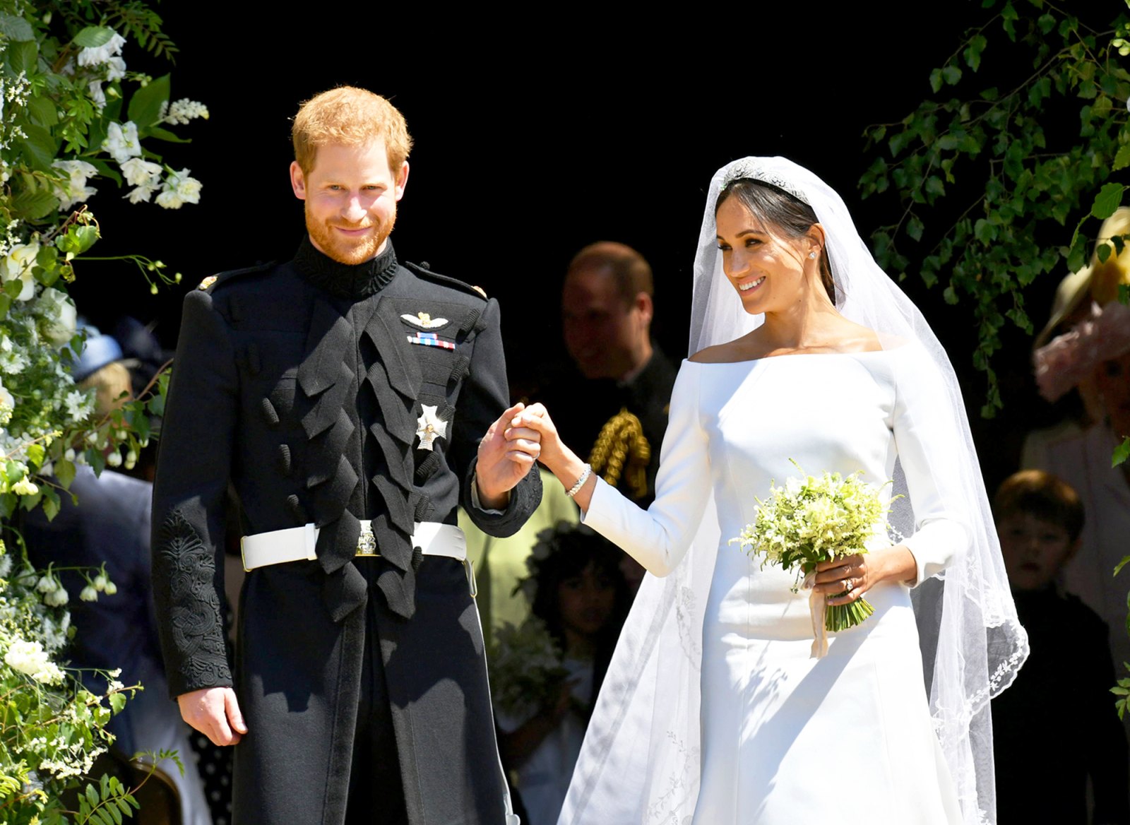 Prince Harry and Meghan Markle leave St George's Chapel after their wedding in St George's Chapel at Windsor Castle on May 19, 2018 in Windsor, England.