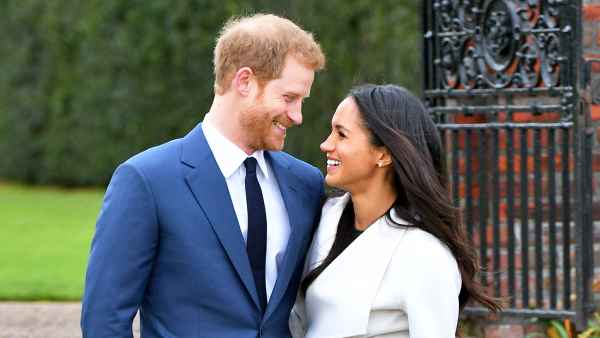 Prince Harry and Meghan Markle during an official photocall to announce their engagement at The Sunken Gardens at Kensington Palace on November 27, 2017 in London, England.