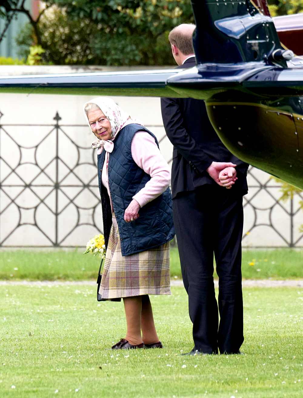 The Queen arrives at Kensington Palace by helicopter to meet Prince Louis for the first time on April 30, 2018.