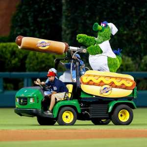 The Philadelphia Phillies mascot the Phillie Phanatic rides a Hatfield Hot Dog cart in the outfield during the game in Philadelphia, Pennsylvania.