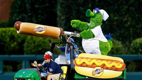 The Philadelphia Phillies mascot the Phillie Phanatic rides a Hatfield Hot Dog cart in the outfield during the game in Philadelphia, Pennsylvania.
