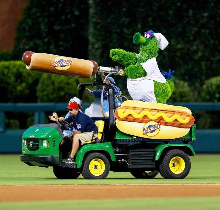 The Philadelphia Phillies mascot the Phillie Phanatic rides a Hatfield Hot Dog cart in the outfield during the game in Philadelphia, Pennsylvania.