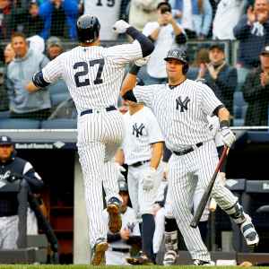 Giancarlo Stanton #27 of the New York Yankees celebrates his first inning two run home run against the Tampa Bay Rays with teammate Gary Sanchez #24 at Yankee Stadium on April 4, 2018 in the Bronx borough of New York City.