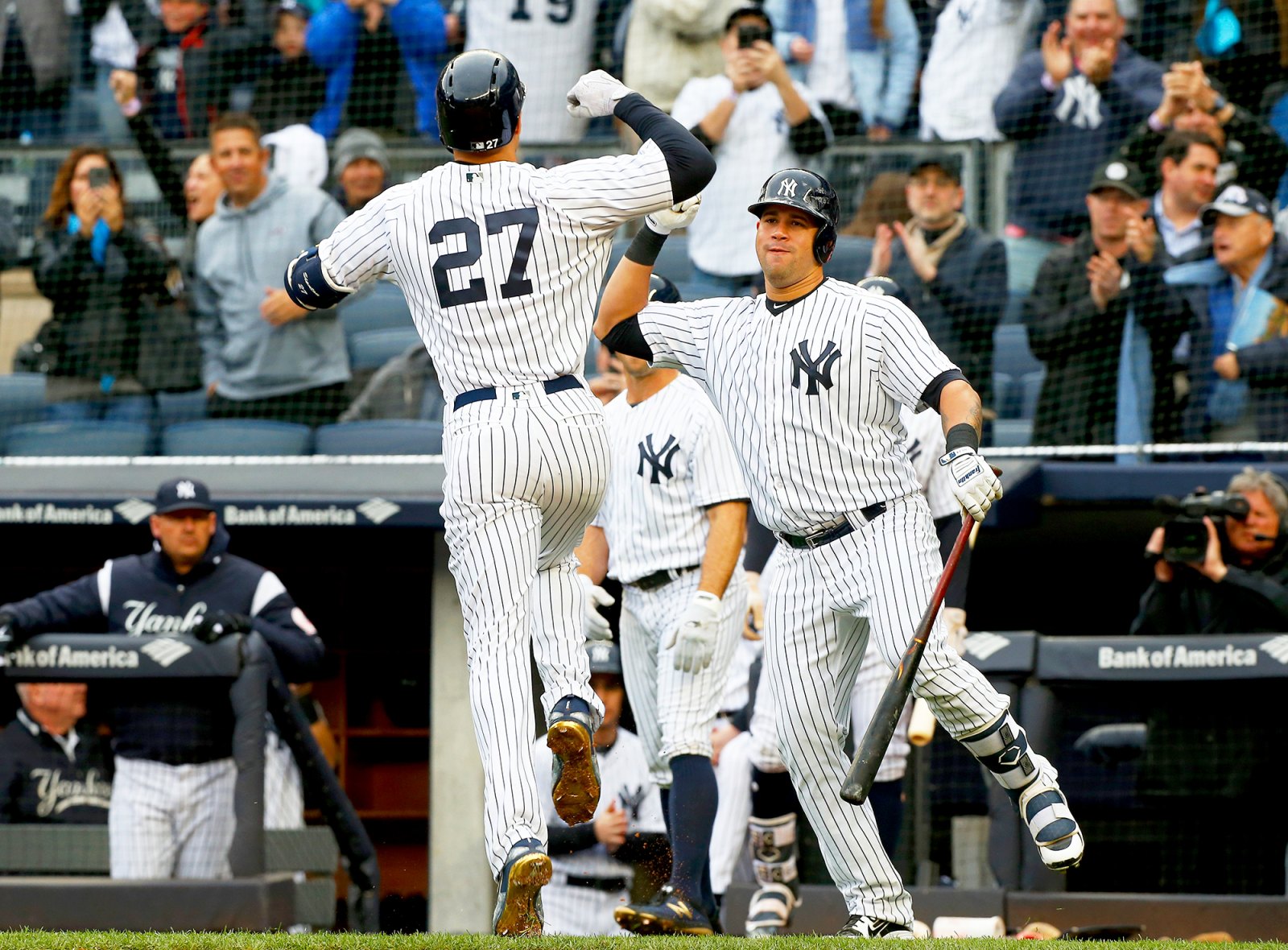 Giancarlo Stanton #27 of the New York Yankees celebrates his first inning two run home run against the Tampa Bay Rays with teammate Gary Sanchez #24 at Yankee Stadium on April 4, 2018 in the Bronx borough of New York City.