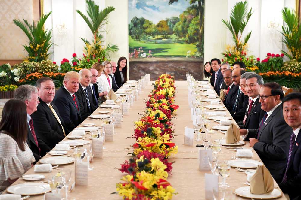 Donald Trump and his delegation share a working lunch Singapore's Prime Minister Lee Hsien Loong and his team during the US leader's visit to The Istana, the official residence of the prime minister in Singapore on June 11, 2018.