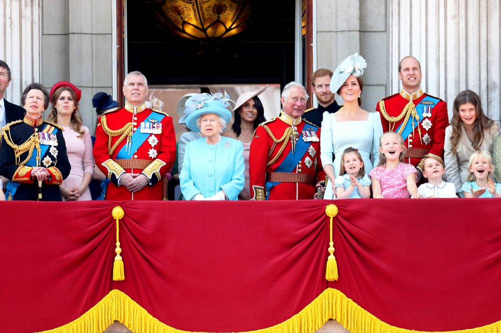 Princess Anne, Princess Royal, Princess Beatrice, Lady Louise Windsor, Prince Andrew, Duke of York, Queen Elizabeth II, Meghan, Duchess of Sussex, Prince Charles, Prince of Wales, Prince Harry, Duke of Sussex, Catherine, Duchess of Cambridge, Prince William, Duke of Cambridge, Princess Charlotte of Cambridge, Savannah Phillips, Prince George of Cambridge and Isla Phillips watch the flypast on the balcony of Buckingham Palace during Trooping The Colour on June 9, 2018 in London, England.