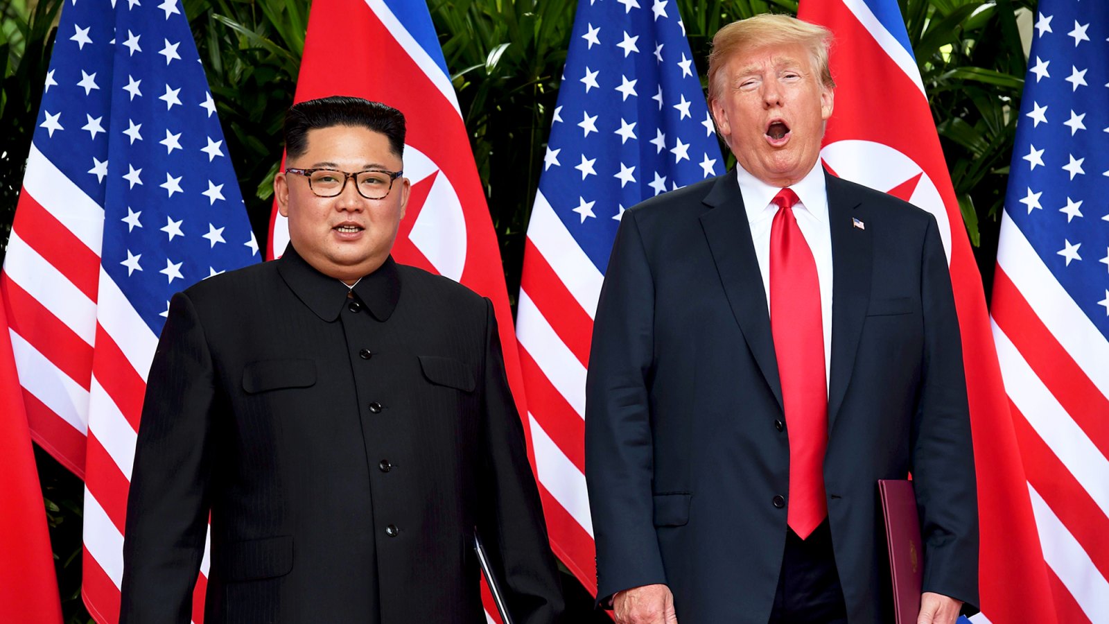 Kim Jong Un and Donald Trump after taking part in a signing ceremony at the end of their historic U.S.-North Korea summit at the Capella Hotel on Sentosa island in Singapore on June 12, 2018.