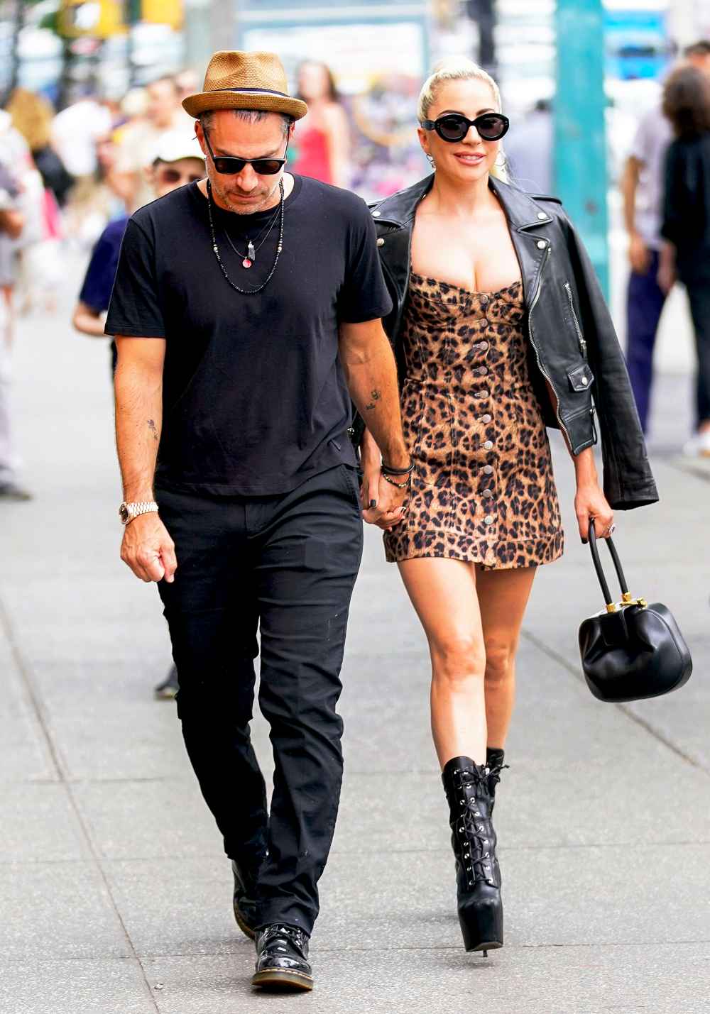 Lady Gaga and Christian Carino walk to her studio on June 28, 2018 in New York City.