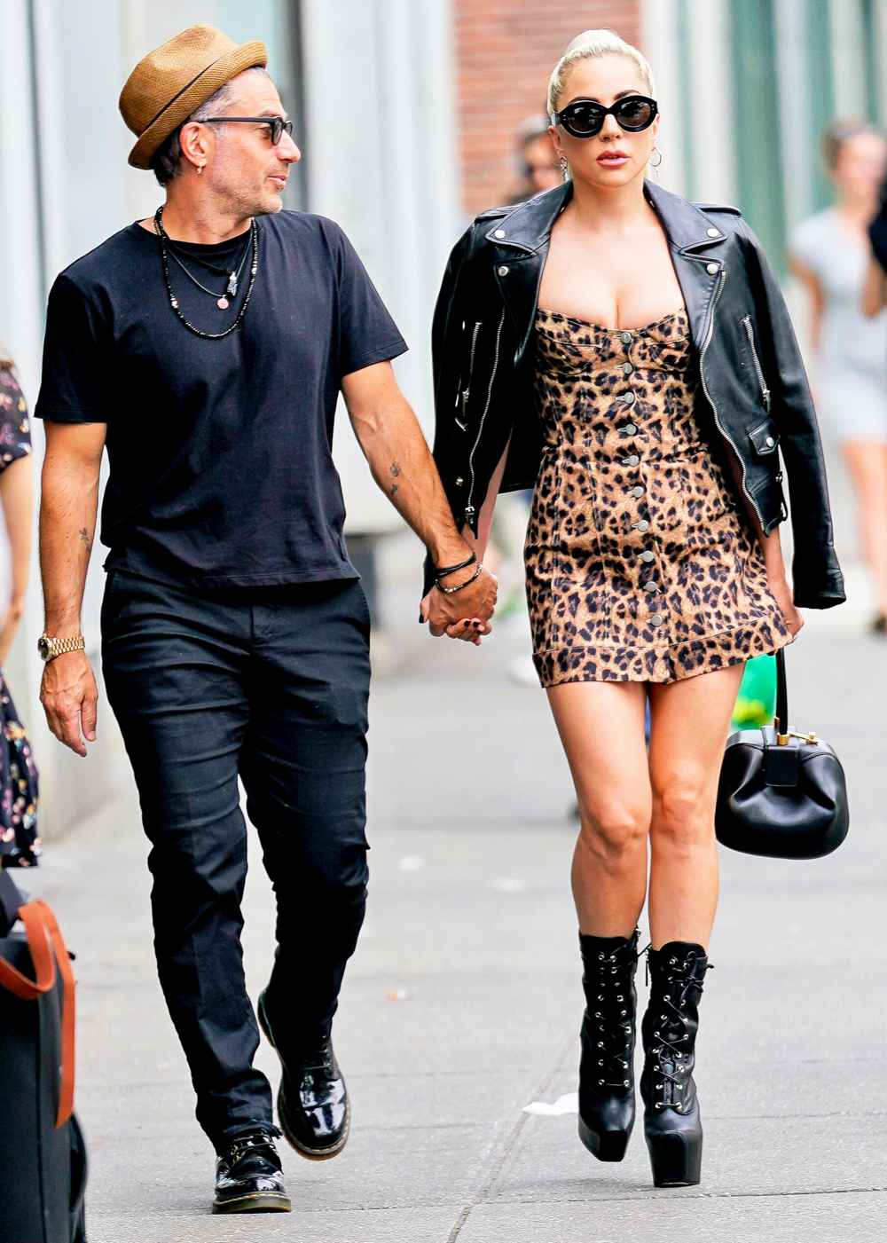 Lady Gaga and Christian Carino walk to her studio on June 28, 2018 in New York City.