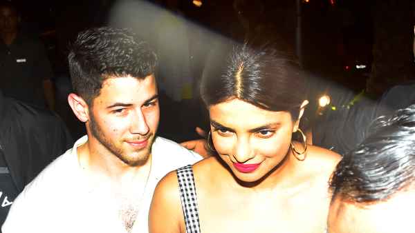 Nick Jonas and Priyanka Chopra walking through the streets of Mumbai on June 22, 2018.