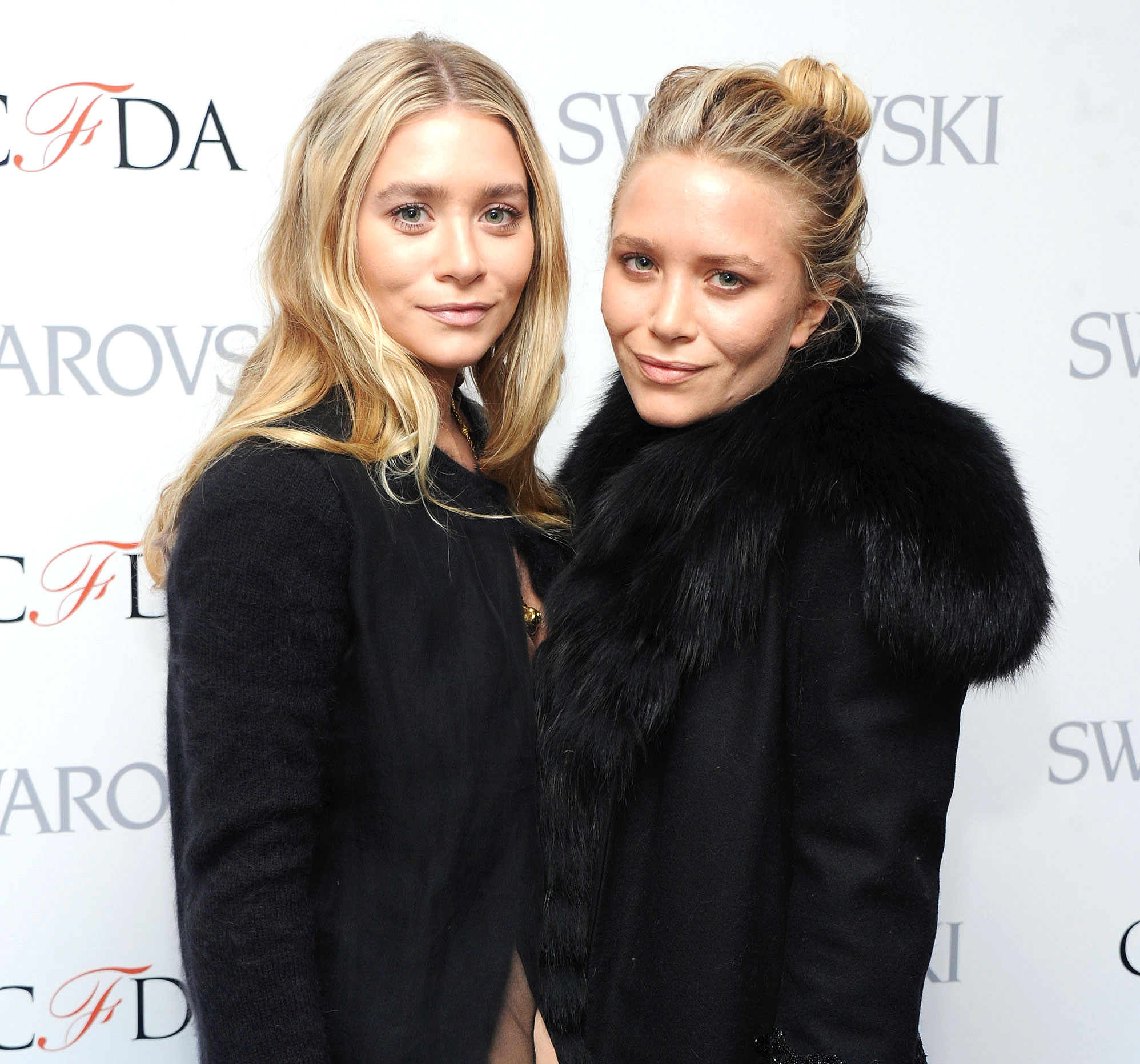 Mary-Kate Olsen keeps warm in an oversized black coat while