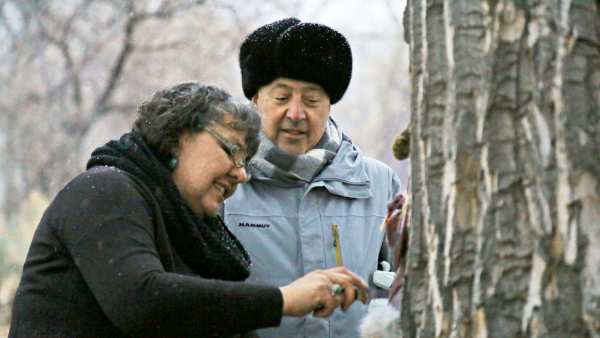 Andrew Zimmern watches Donna Cossette skin a wild jackrabbit in preparation for a native Paiute meal near the Pony Express Trail in western Nevada.