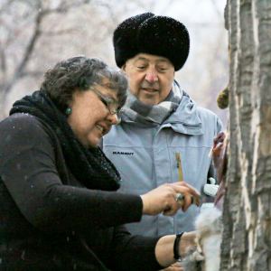 Andrew Zimmern watches Donna Cossette skin a wild jackrabbit in preparation for a native Paiute meal near the Pony Express Trail in western Nevada.