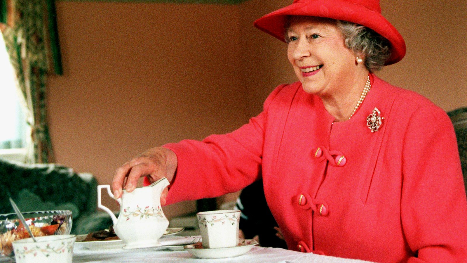 Queen Elizabeth drinking tea