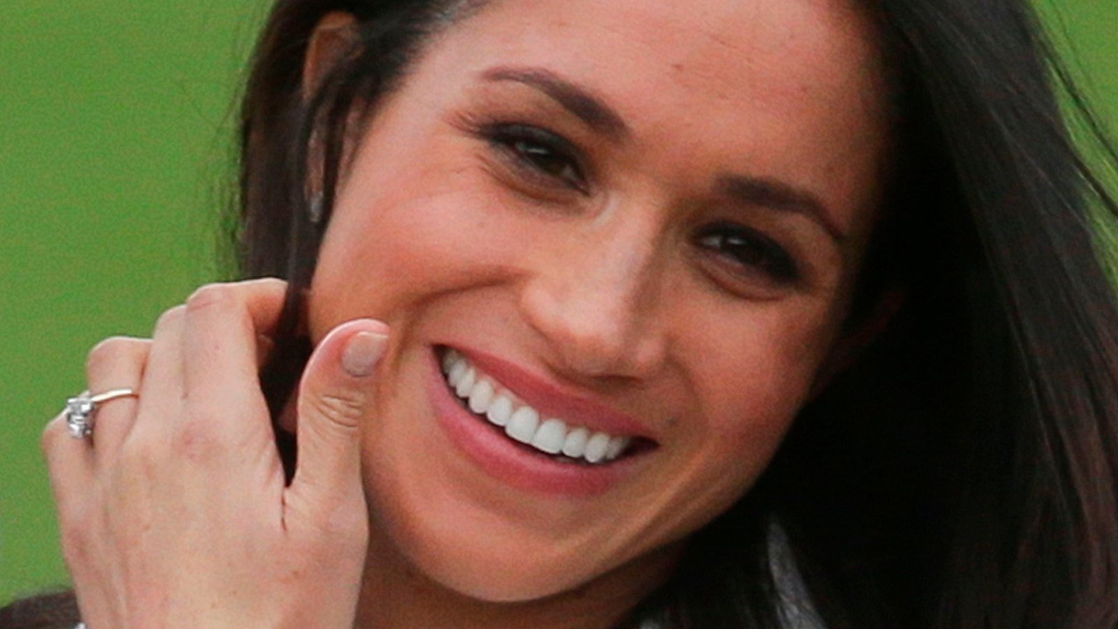 US actress Meghan Markle shows off her engagement ring she poses with her fiancée Britain's Prince Harry in the Sunken Garden at Kensington Palace in west London on November 27, 2017, following the announcement of their engagement. - Britain's Prince Harry will marry his US actress girlfriend Meghan Markle early next year after the couple became engaged earlier this month, Clarence House announced on Monday. (Photo by Daniel LEAL-OLIVAS / AFP) (Photo credit should read DANIEL LEAL-OLIVAS/AFP/Getty Images)