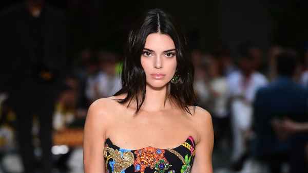 US model Kendall Jenner presents a creation by Versace during the men & women's spring/summer 2019 collection fashion show in Milan, on June 16, 2018. (Photo by MIGUEL MEDINA / AFP) (Photo credit should read MIGUEL MEDINA/AFP/Getty Images)