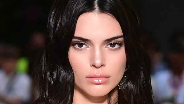 US model Kendall Jenner presents a creation by Versace during the men & women's spring/summer 2019 collection fashion show in Milan, on June 16, 2018. (Photo by MIGUEL MEDINA / AFP) (Photo credit should read MIGUEL MEDINA/AFP/Getty Images)